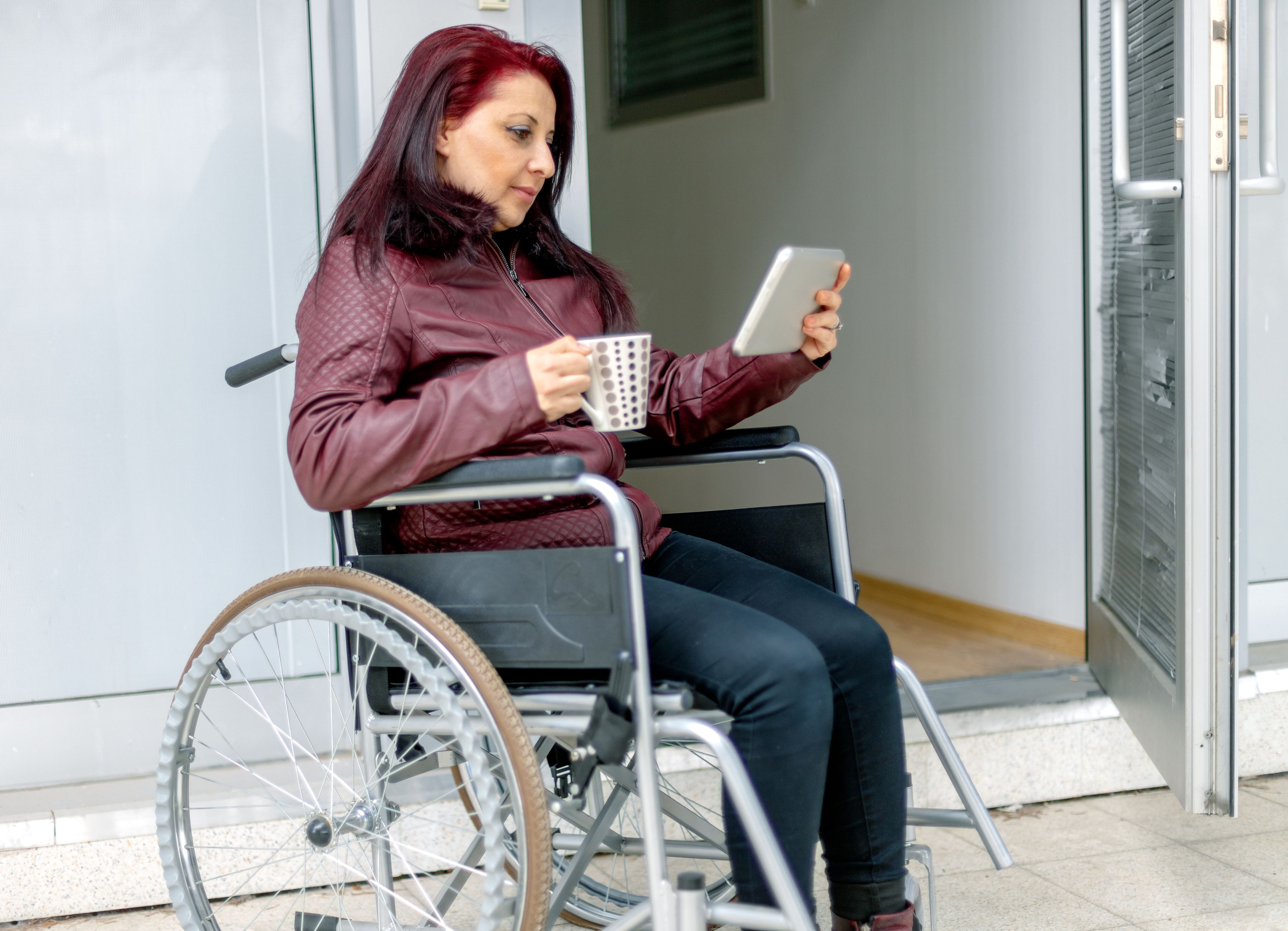 train on bridge surrounded with trees at daytime