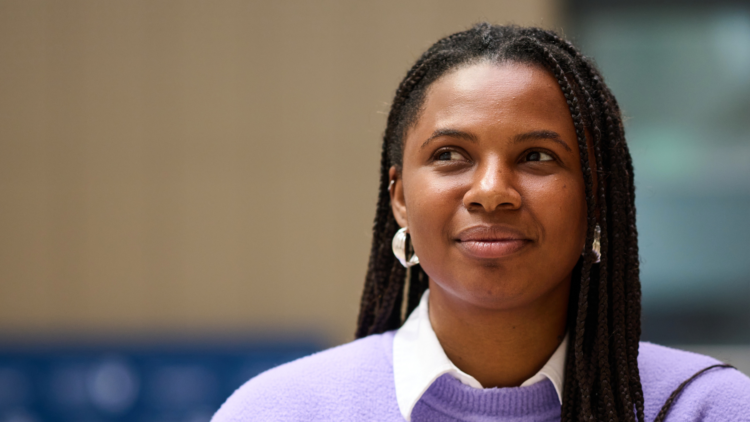 Background image of woman part of the 'Waiting for a Way Forward' projectat RCOG  building