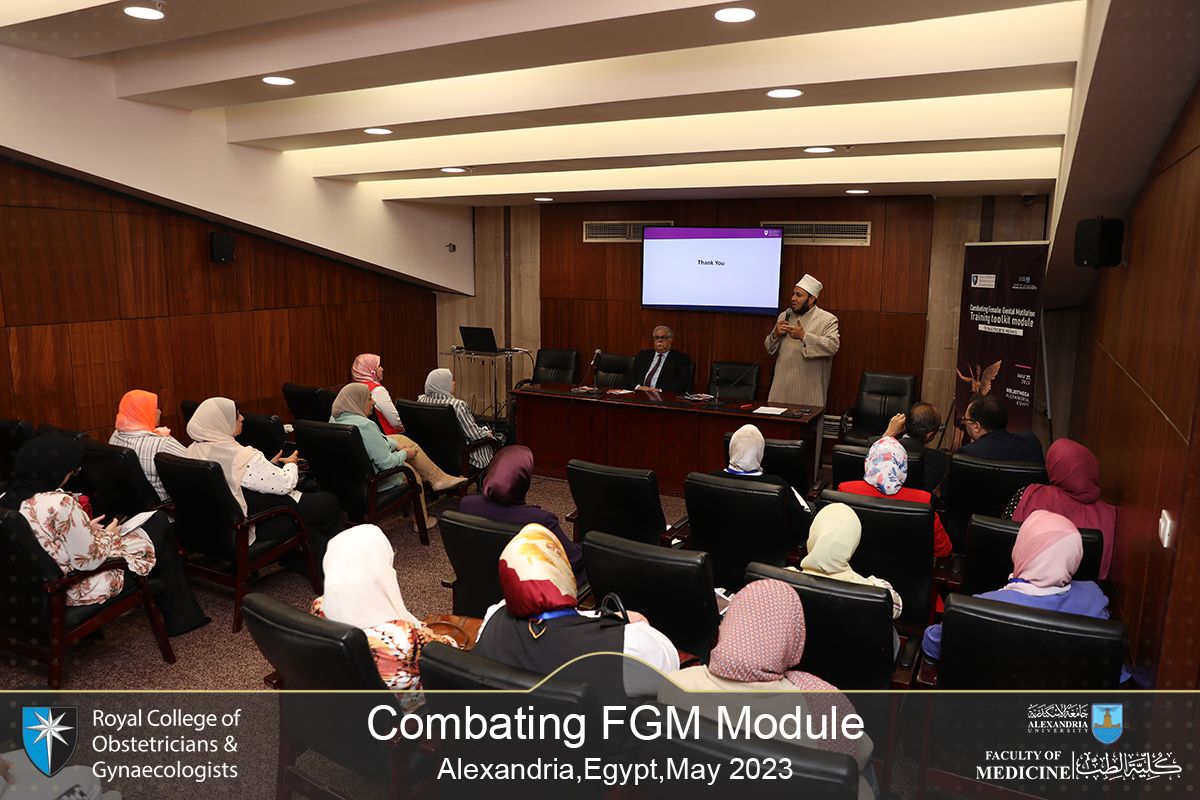 A man presenting to a small audience of people at the RCOG anti-FGM workshop in Egypt