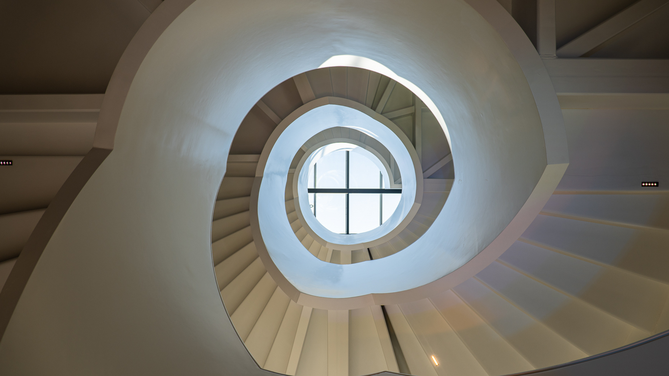 A photo of the spiral staircase at the RCOG building, taken from below