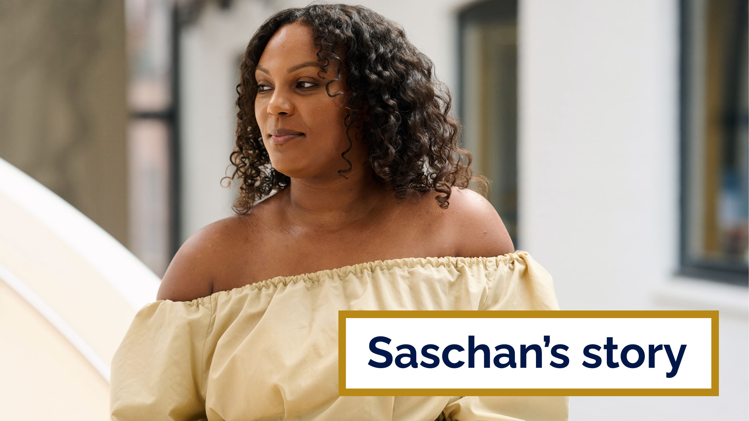 A photo of Saschan from the RCOG Women's Network. She stands by the spiral staircase at Union Street and looks into the distance.