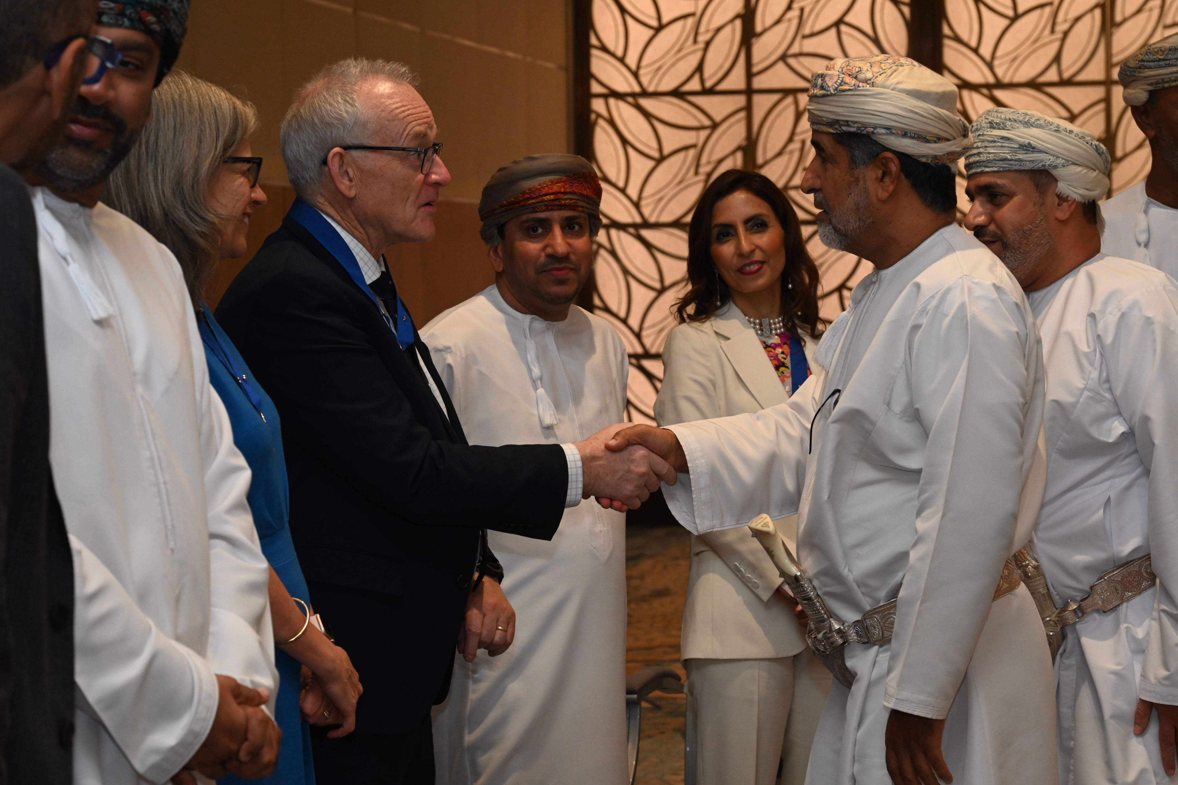 RCOG Vice President for Education, Ian Scudamore, shaking hands with government officials in Oman